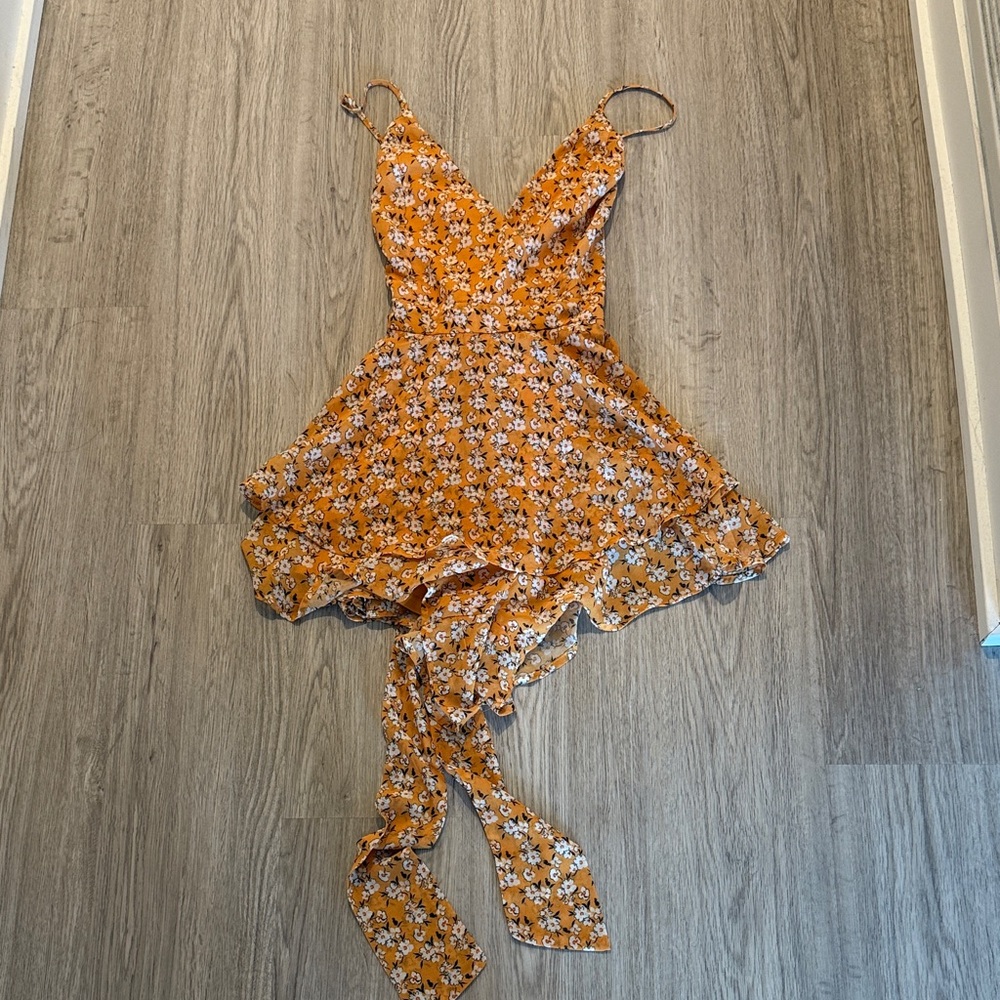 Yellow floral romper size large